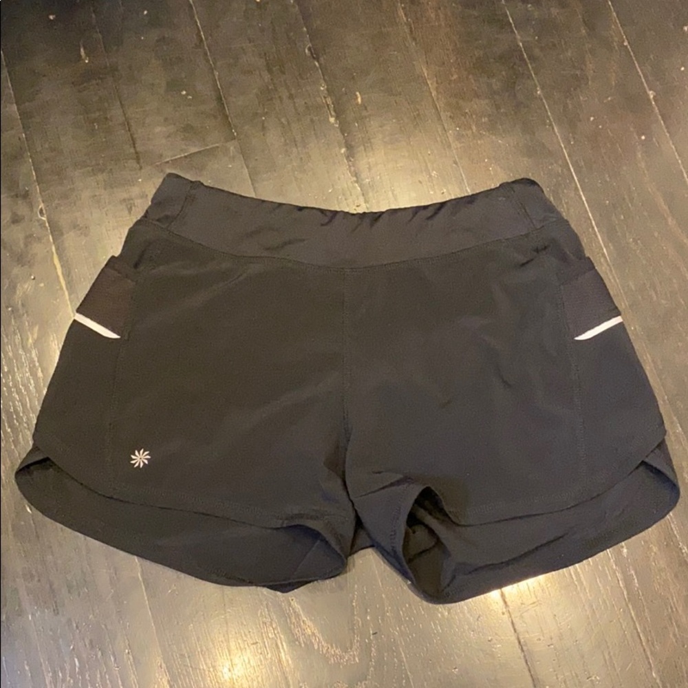 Shorts with reflective strips and pockets